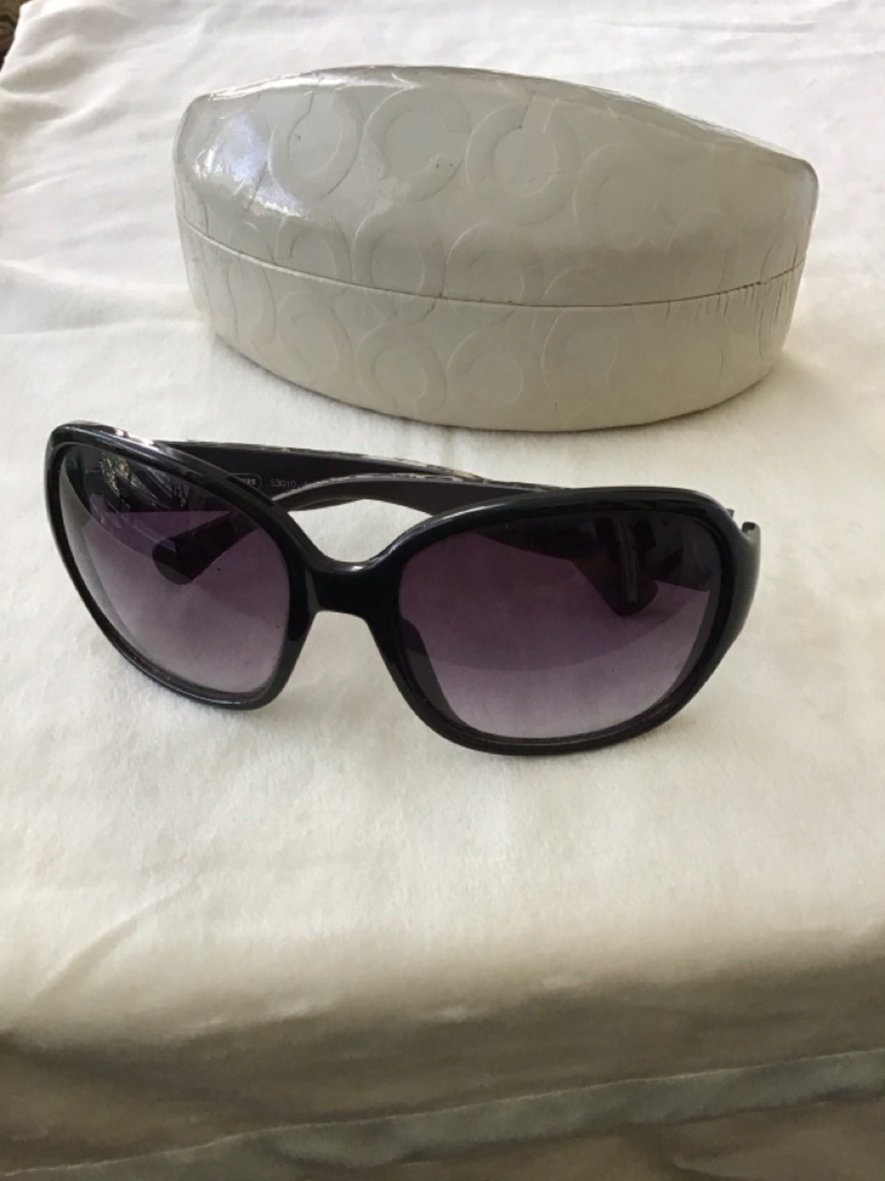 Elegant Coach S3010 Black sunglasses and case.